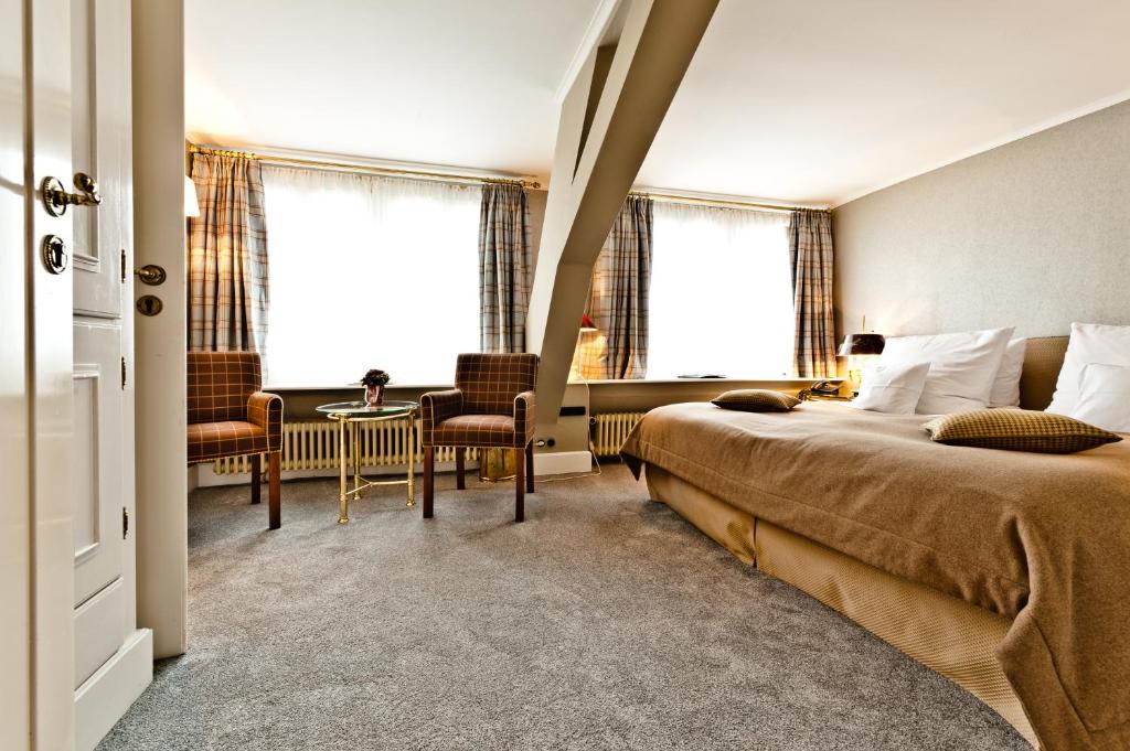 Postel nebo postele na pokoji v ubytování Hotel Kronenschlösschen