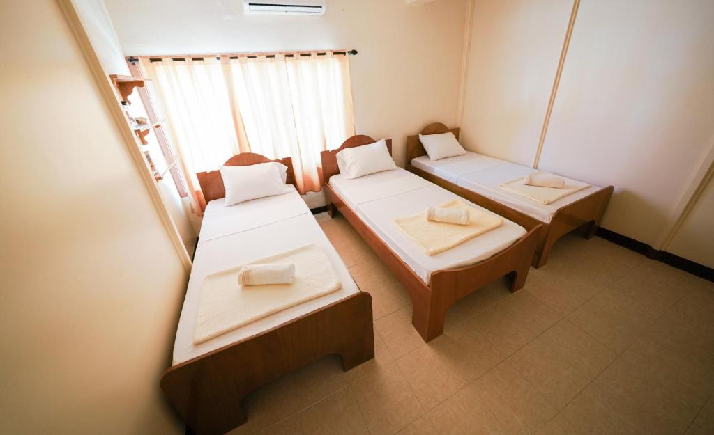 Postel nebo postele na pokoji v ubytování Yogi-Homestay