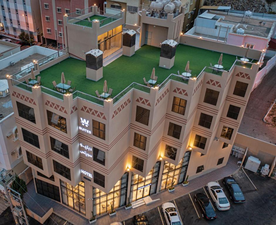 an overhead view of a building with lights on at W Suites Hotel in Abha