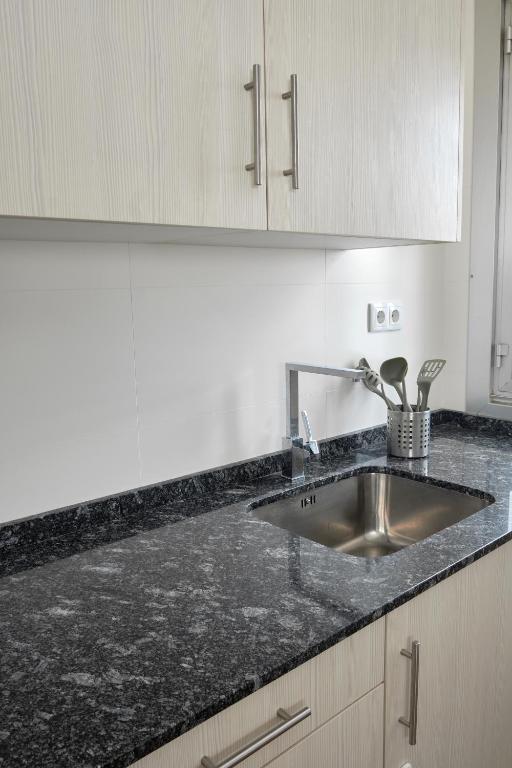 Kuchyň nebo kuchyňský kout v ubytování Apartamento El Coso