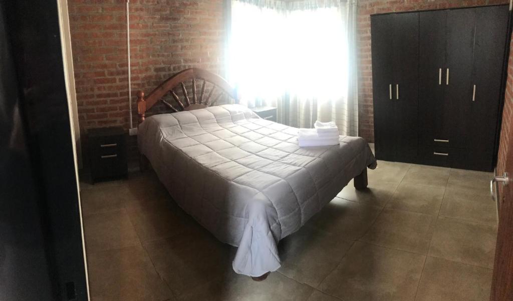 Ένα ή περισσότερα κρεβάτια σε δωμάτιο στο Los Tres Algarrobos