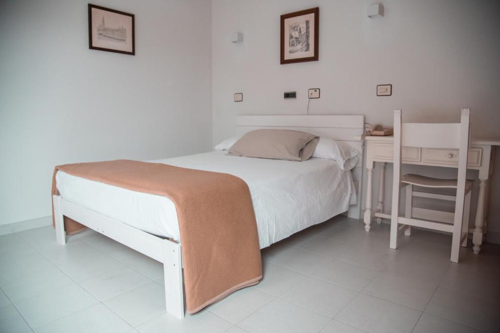 Posteľ alebo postele v izbe v ubytovaní Hotel Los Olmos