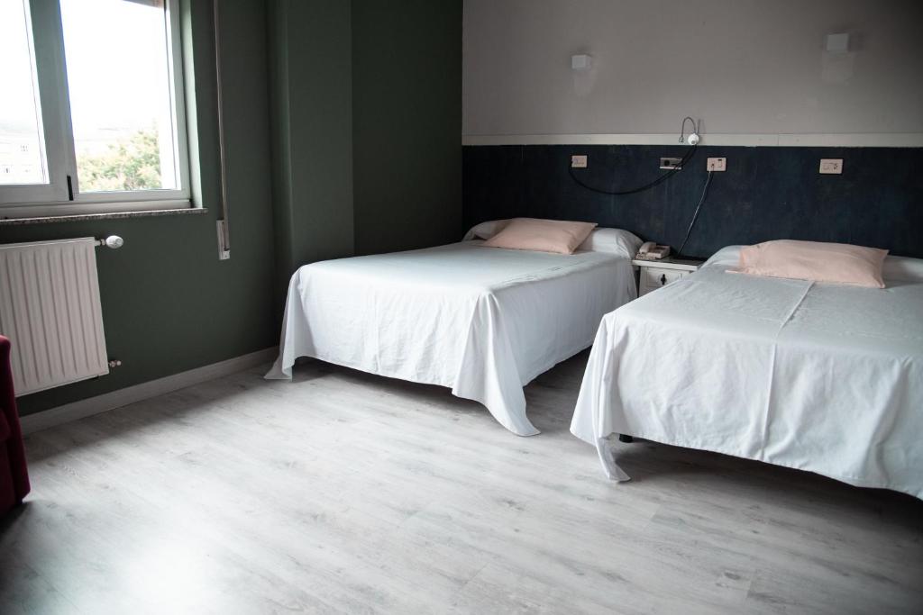 Posteľ alebo postele v izbe v ubytovaní Hotel Los Olmos