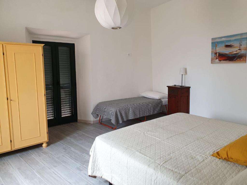 Postel nebo postele na pokoji v ubytování alcastello - casa campanile
