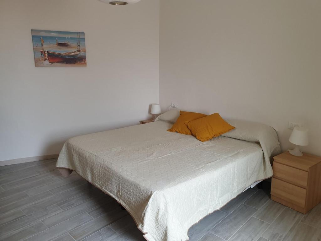 Postel nebo postele na pokoji v ubytování alcastello - casa campanile