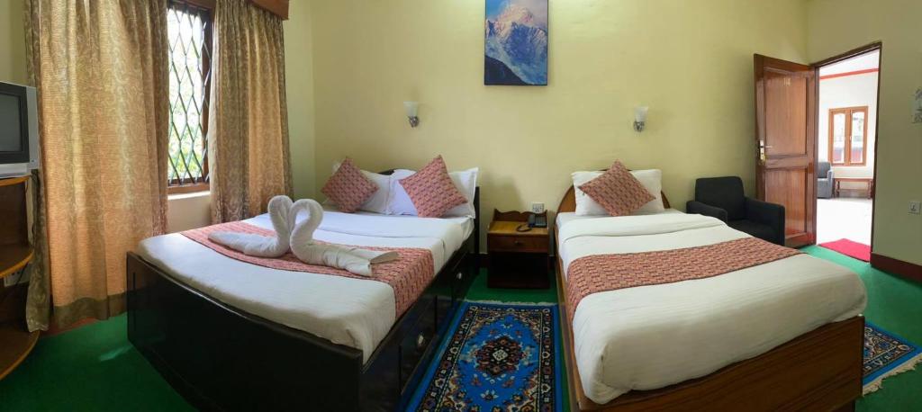 Postel nebo postele na pokoji v ubytování Hotel Blue Magnet