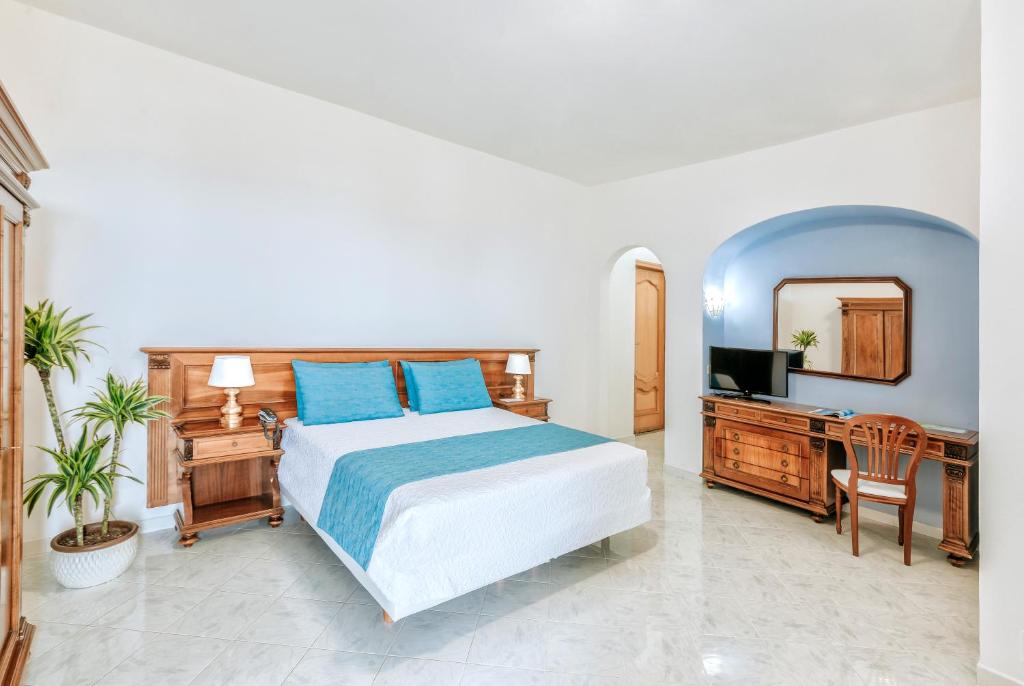 Postel nebo postele na pokoji v ubytování Hotel Zaro