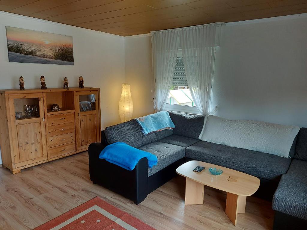 a living room with a couch and a table at Ferien auf dem Land in Warstein