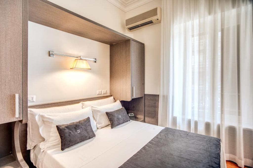 Postel nebo postele na pokoji v ubytování Hotel Mirti