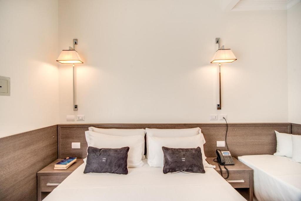 Postel nebo postele na pokoji v ubytování Hotel Mirti