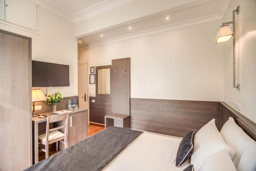 Postel nebo postele na pokoji v ubytování Hotel Mirti