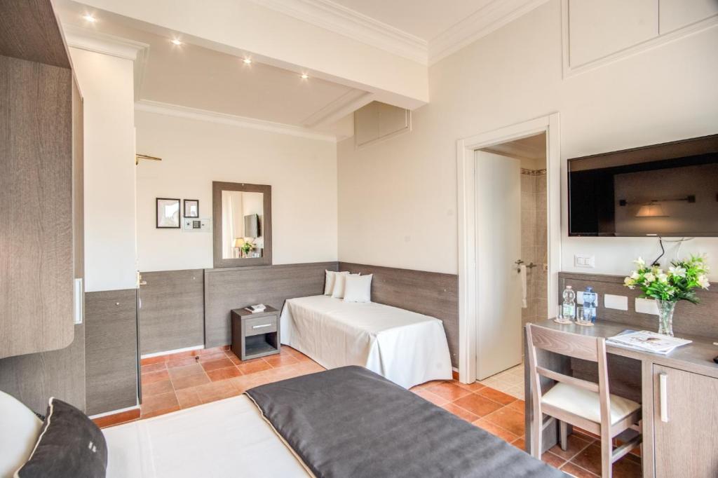 Postel nebo postele na pokoji v ubytování Hotel Mirti