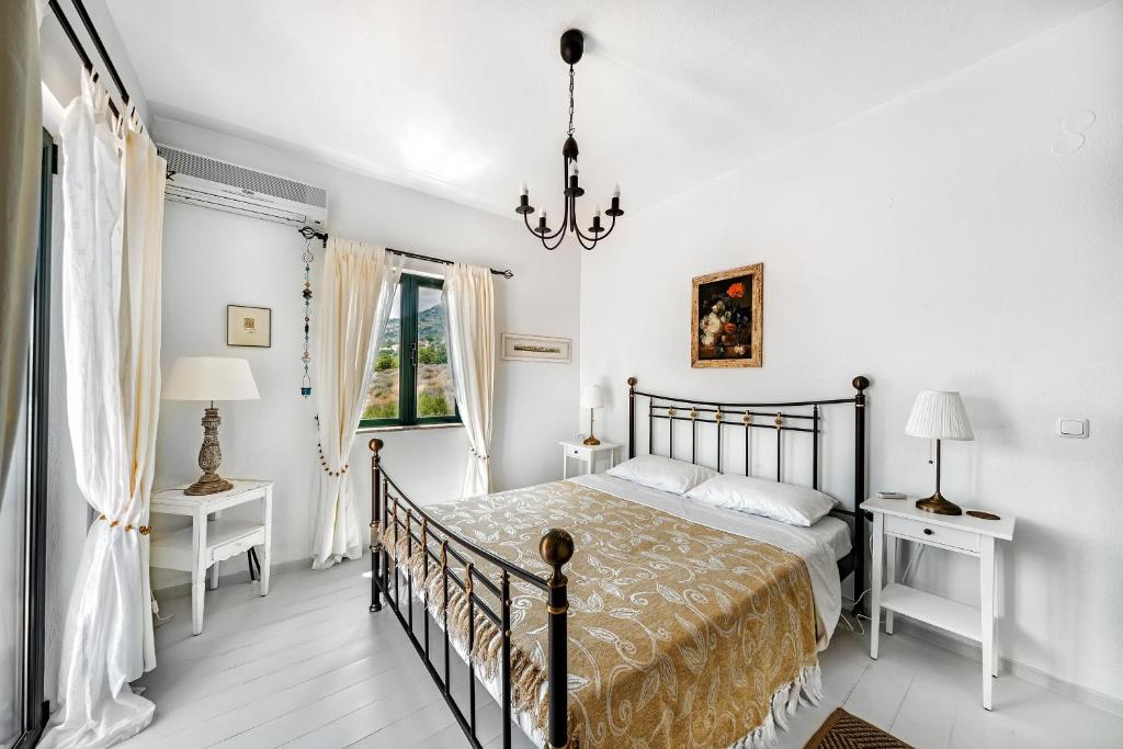 Postel nebo postele na pokoji v ubytování Villa Artemis