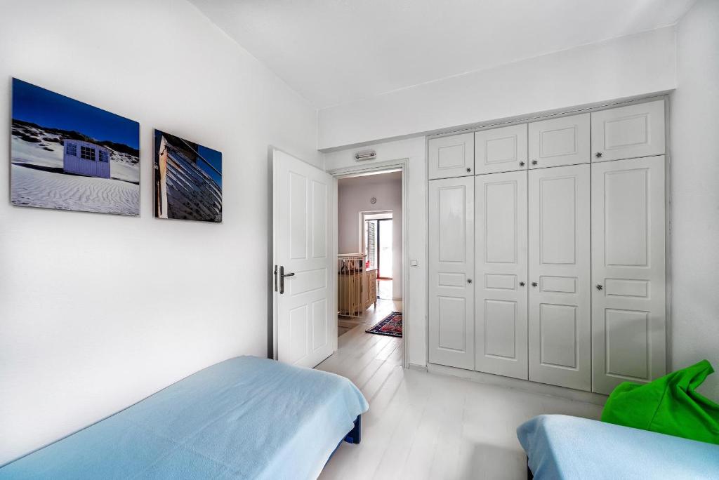 Postel nebo postele na pokoji v ubytování Villa Artemis