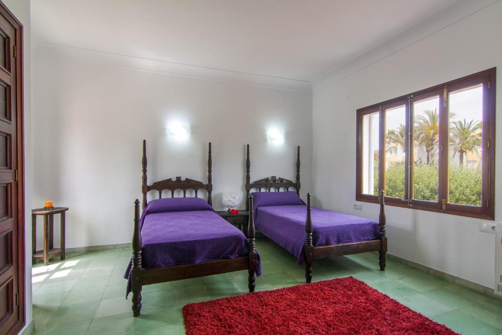 Postel nebo postele na pokoji v ubytování Villa Comes