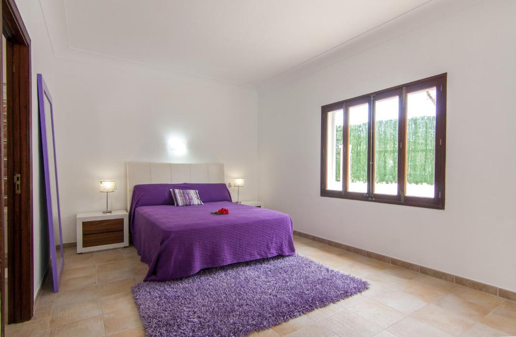 Postel nebo postele na pokoji v ubytování Villa Comes