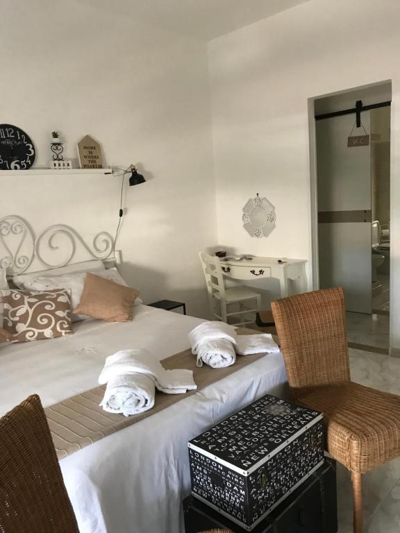 Postel nebo postele na pokoji v ubytování Eder Home A un passo dal Teatro Greco