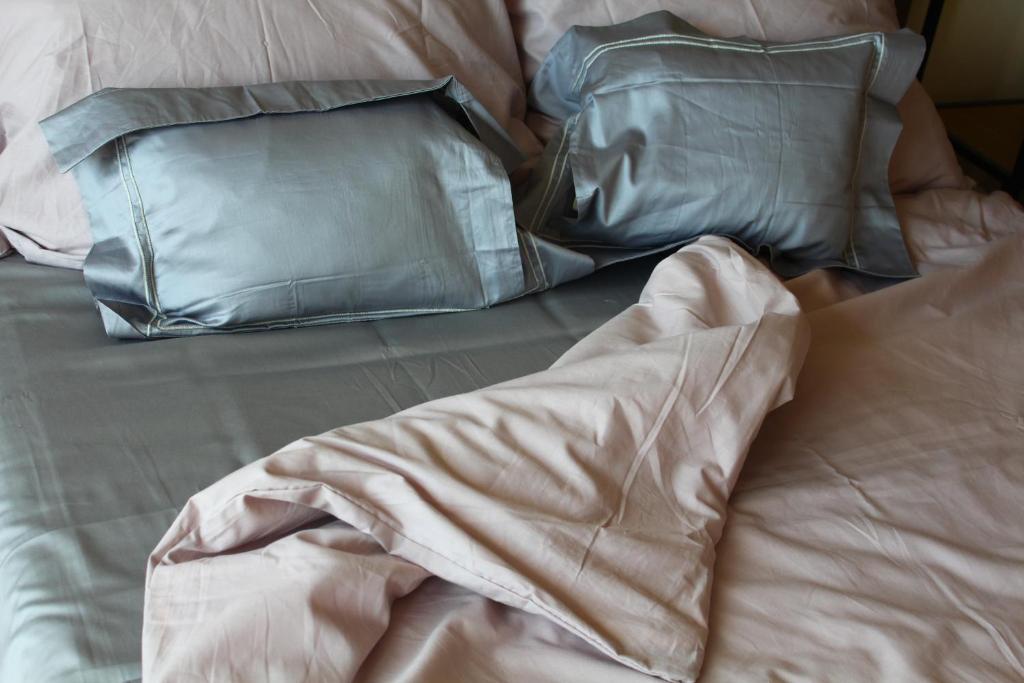 A bed or beds in a room at Exceptional Accommodation