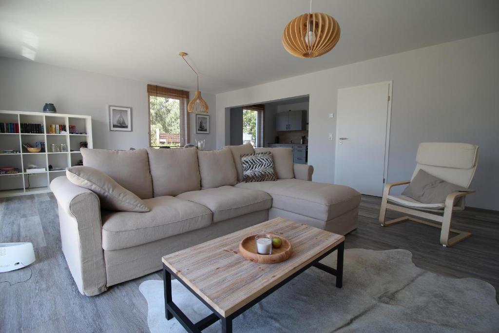 a living room with a couch and a coffee table at Bodden Perle in Dierhagen