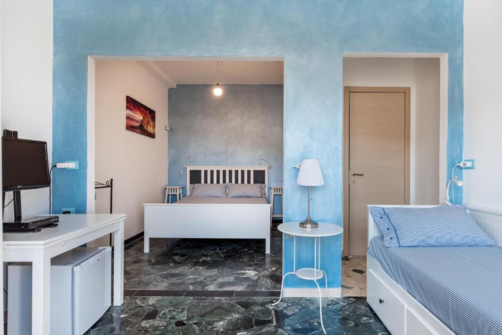 A bed or beds in a room at Affittacamere la Tortuga
