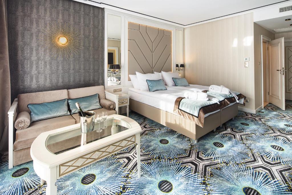 Łóżko lub łóżka w pokoju w obiekcie Hotel Royal Baltic 4* Luxury Boutique