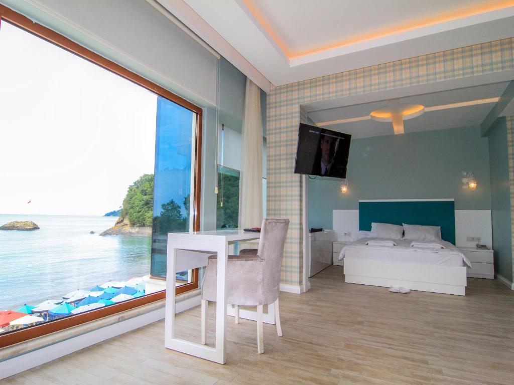 Postel nebo postele na pokoji v ubytování Yildiz Apart Hotel