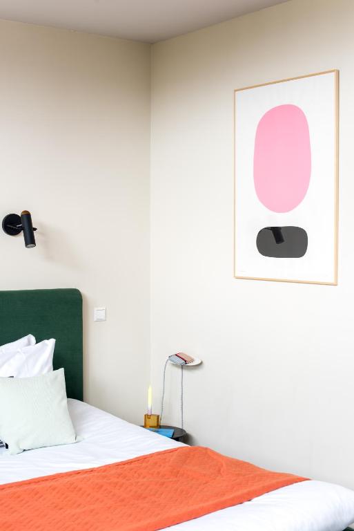 Llit o llits en una habitació de Hotel Unplugged