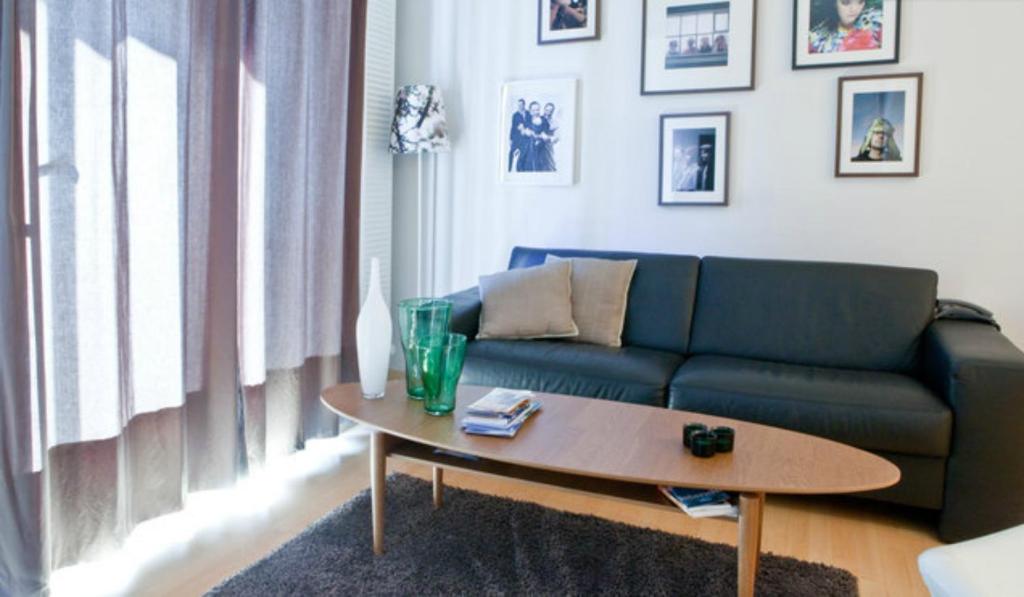 a living room with a couch and a coffee table at City Center Luxury Apartment in Reykjavík