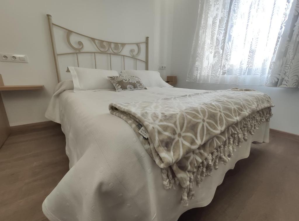 Postel nebo postele na pokoji v ubytování Hostal Óleo Auto Check-in