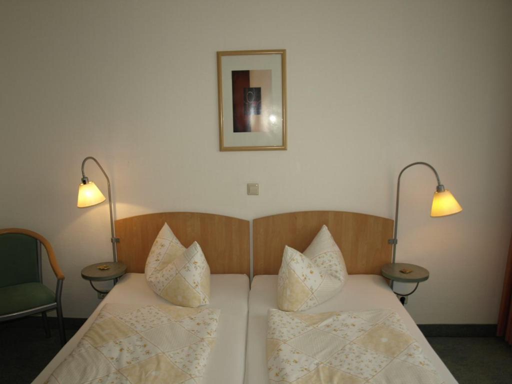Postel nebo postele na pokoji v ubytování Central-Classic Hotel