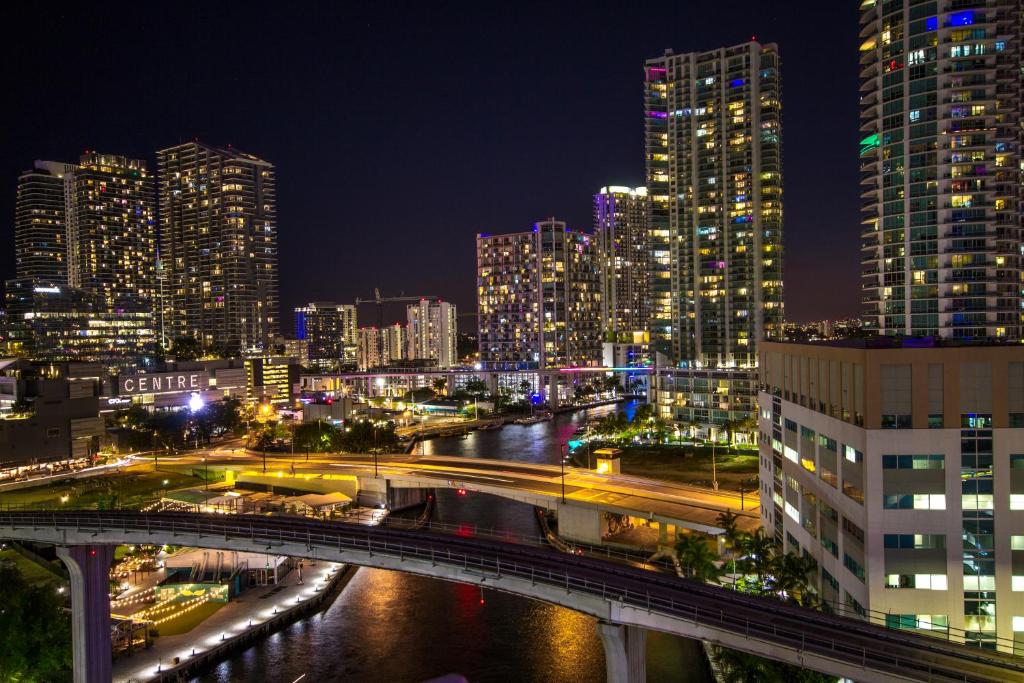 a city at night with a bridge over a river at Comfort Inn & Suites Downtown Brickell-Port of Miami in Miami