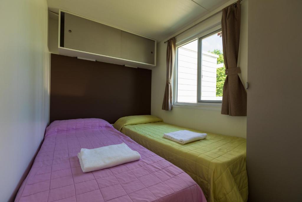 Postel nebo postele na pokoji v ubytování Agriturismo L'Acero Rosso