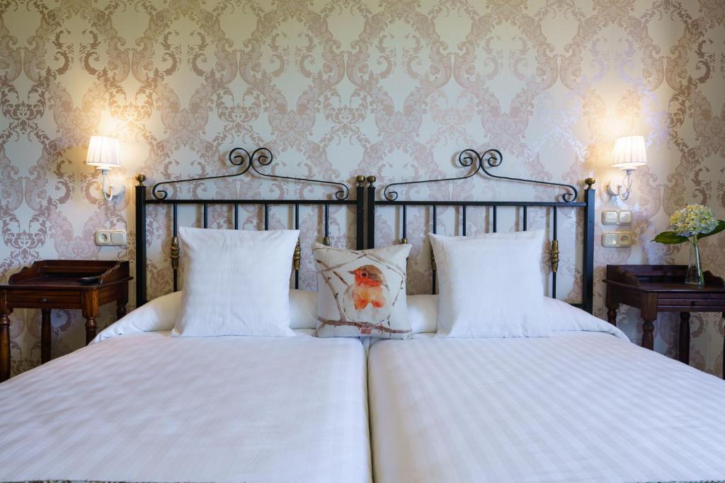 Postel nebo postele na pokoji v ubytování Lar da Mota Boutique Hotel