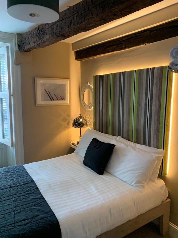 Postel nebo postele na pokoji v ubytování 7 Boutique Hotel