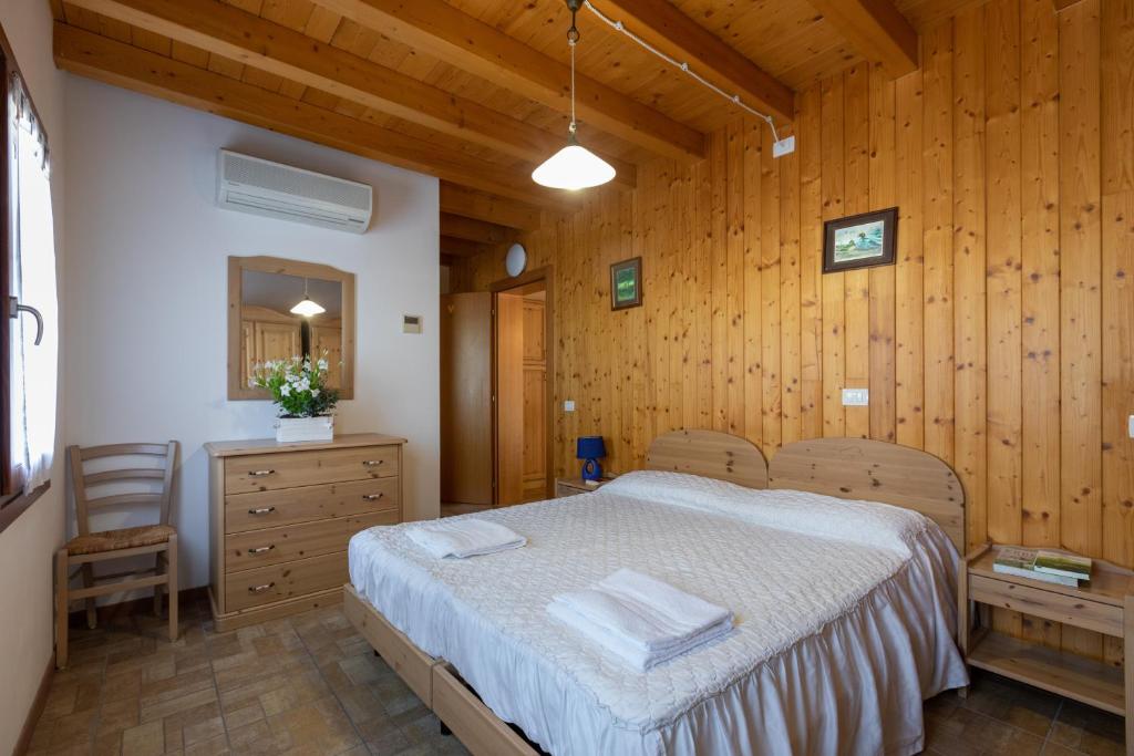 Postel nebo postele na pokoji v ubytování Agriturismo L'Acero Rosso