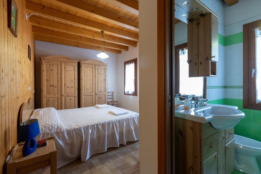 Postel nebo postele na pokoji v ubytování Agriturismo L'Acero Rosso