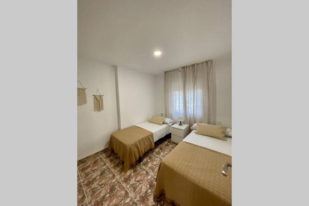 A bed or beds in a room at Holiday apartment