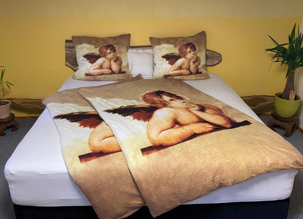 a bed with two naked men on it at Haus Grüne Idylle in Bannewitz
