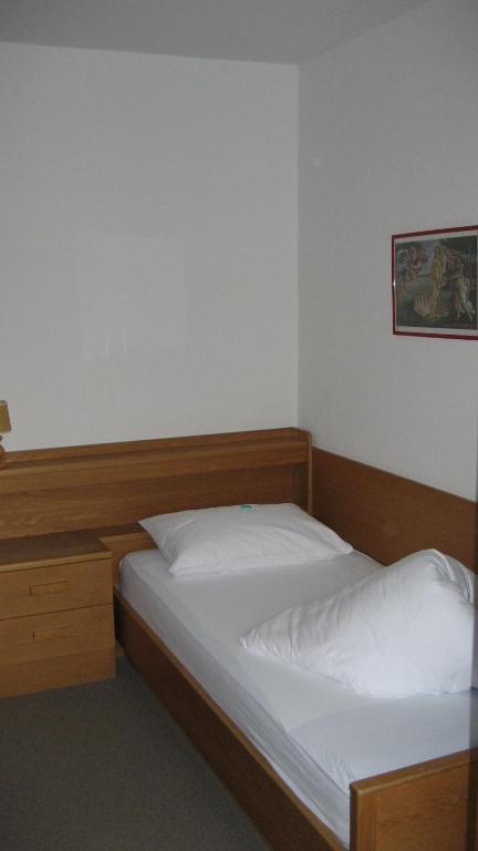 Postel nebo postele na pokoji v ubytování Garni Kofler