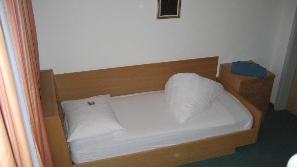 Postel nebo postele na pokoji v ubytování Garni Kofler