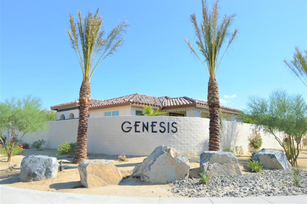 a house with palm trees and a sign that reads genesis at Oasis at Genesis - 30 Day in Palm Desert