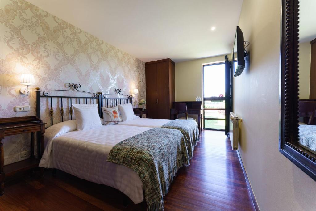 Postel nebo postele na pokoji v ubytování Lar da Mota Boutique Hotel
