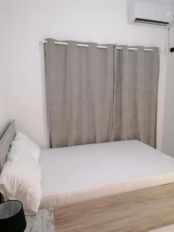 Postel nebo postele na pokoji v ubytování Jz Plus Classio