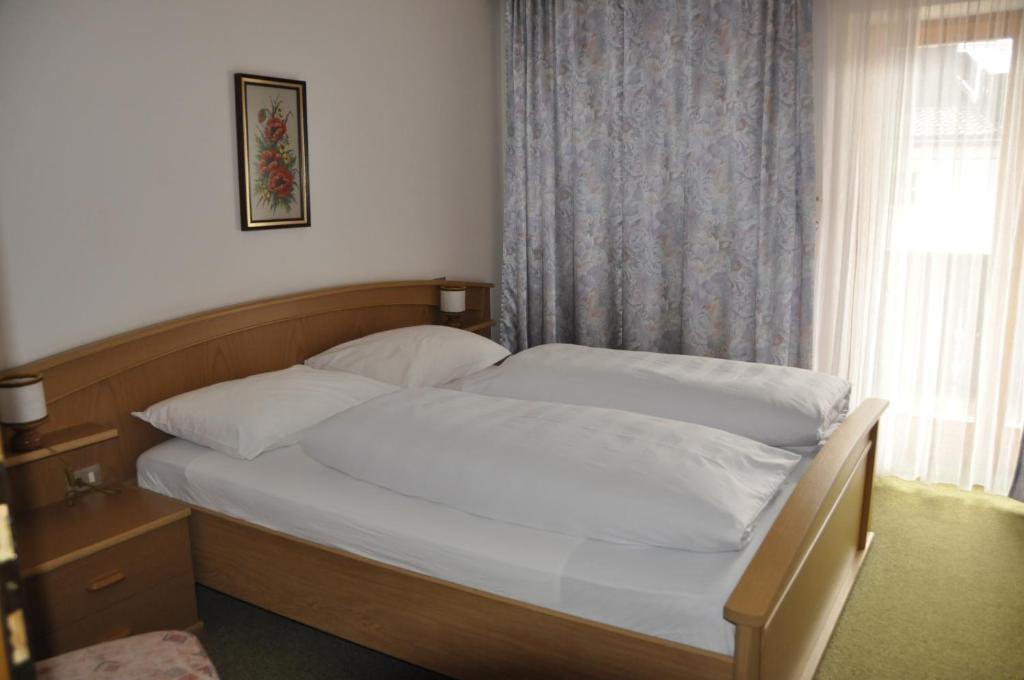Postel nebo postele na pokoji v ubytování Garni Kofler
