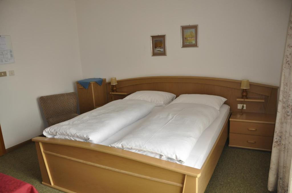 Postel nebo postele na pokoji v ubytování Garni Kofler
