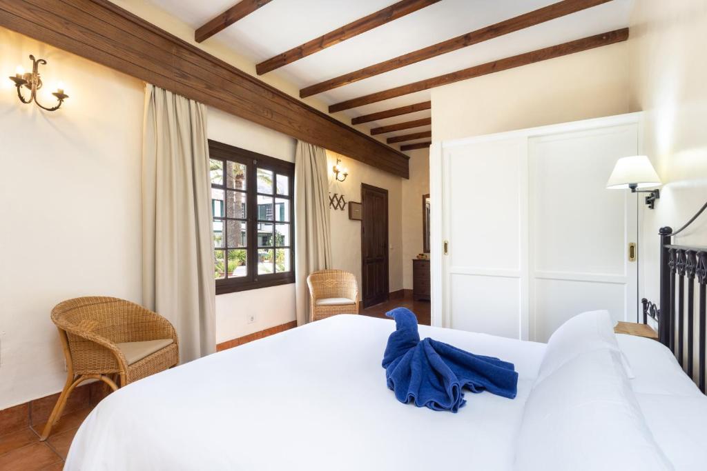 Uma cama ou camas num quarto em Hotel El Patio