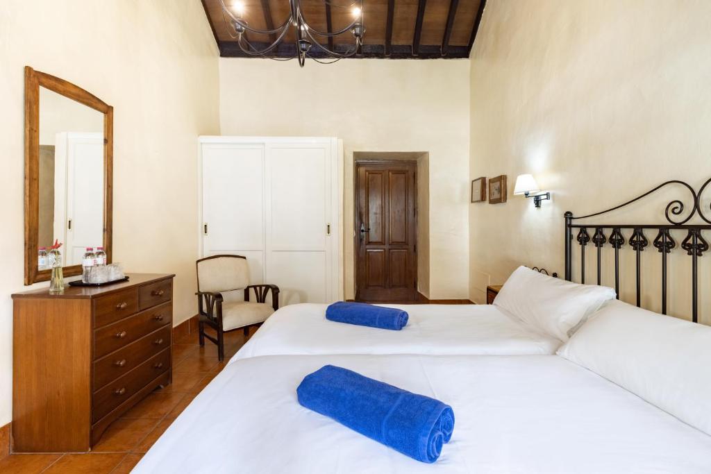 Uma cama ou camas num quarto em Hotel El Patio