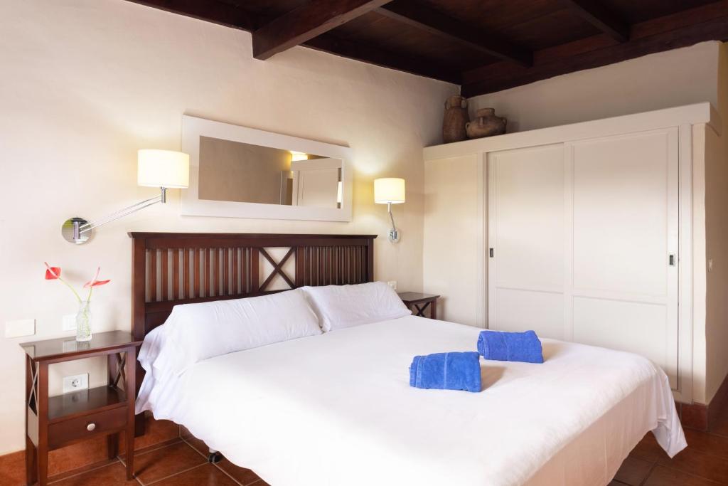Uma cama ou camas num quarto em Hotel El Patio