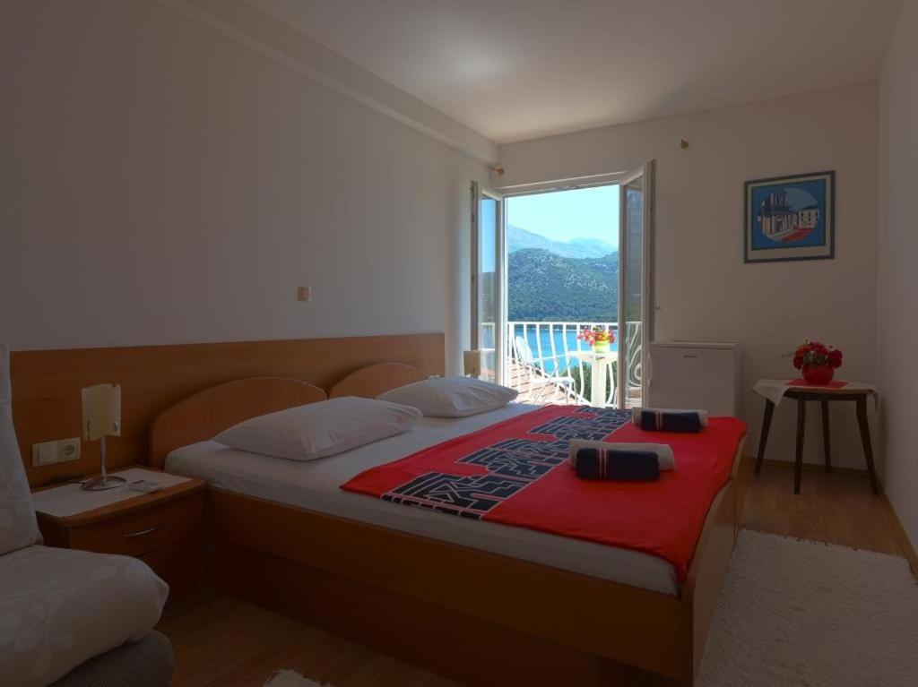 Posteľ alebo postele v izbe v ubytovaní Apartments & Room Eva Slano