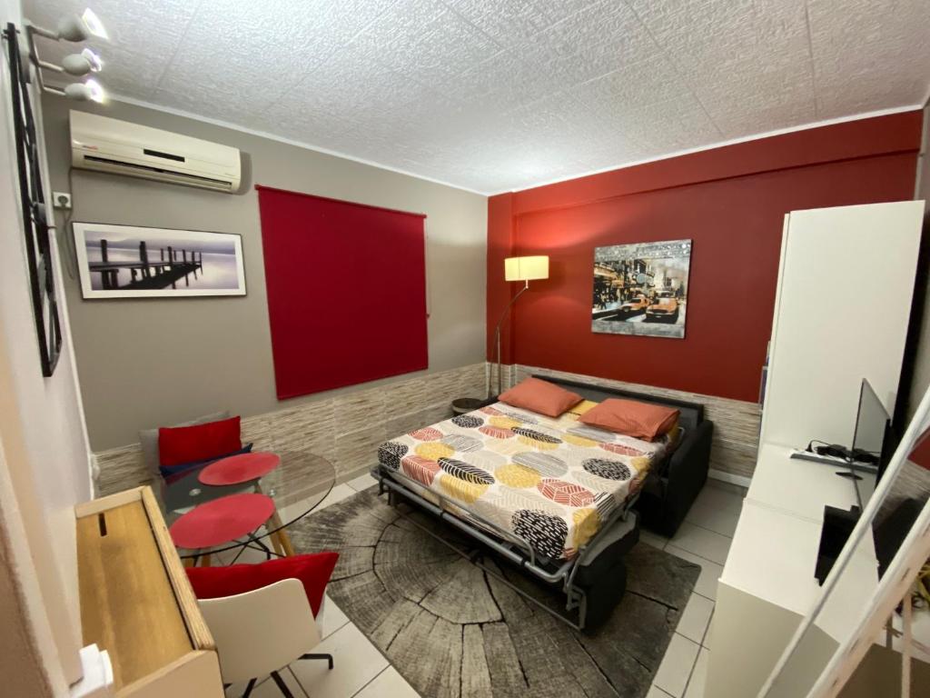 Ένα ή περισσότερα κρεβάτια σε δωμάτιο στο Studio design climatisé Schoelcher